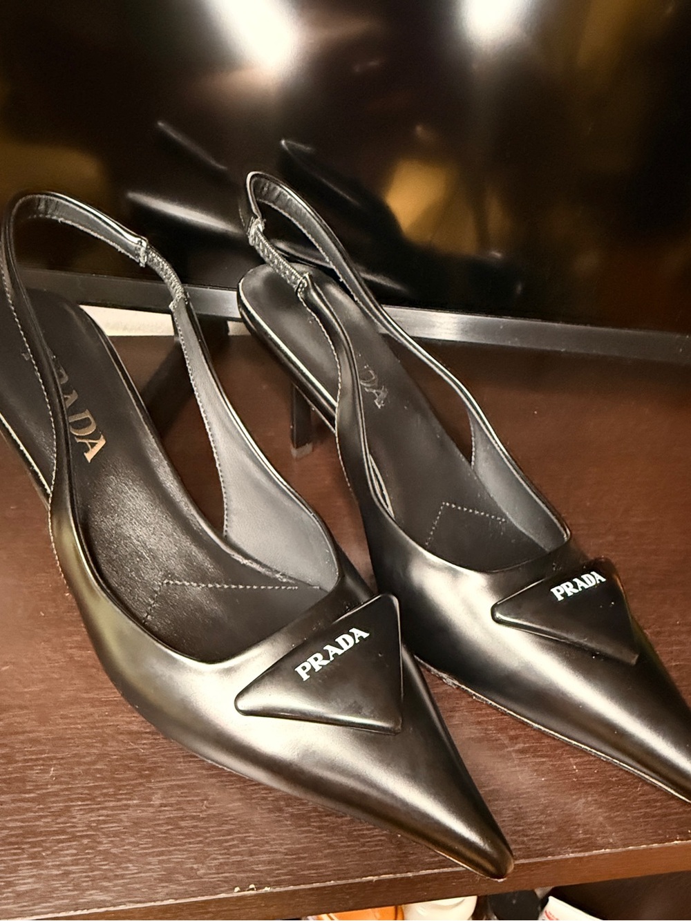 Prada Black Leather Pointed Slingback Heels with Logo Plaque